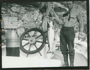 Image: George Crosby holding up salmon